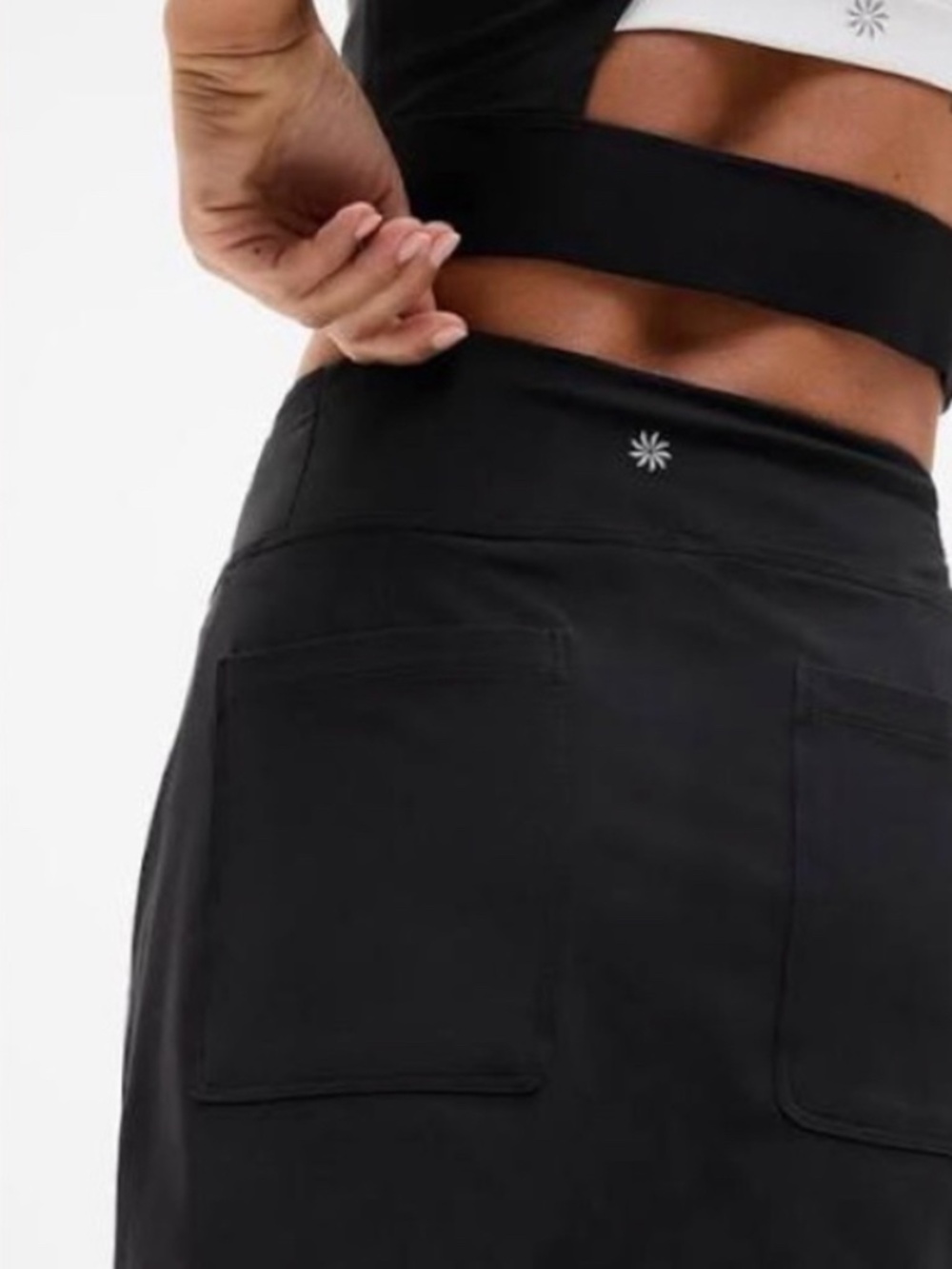 Athleta black high-rise active skort with rear patch pockets